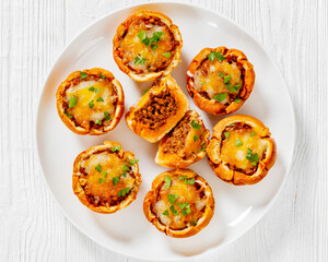 sloppy joe cups on white plate, top view