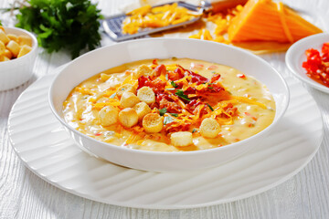 savory creamy pumpkin soup in bowl, top view