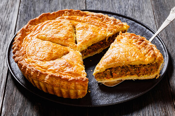 Ground Beef Meat Pie on dark wooden table