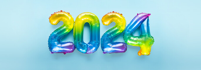 2024 numbers by rainbow foil balloons. New Year layout.