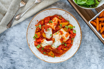 Sicilian fish with pepper sauce and sweet potato chips