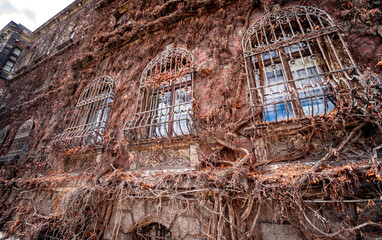 Facade of a old european historical building with vintage windows and doors