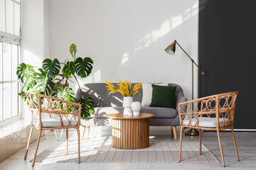 Interior of bright living room with armchairs, sofa and coffee table