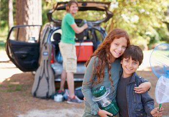 Happy siblings, portrait and hug for road trip, camping or family vacation together in nature....