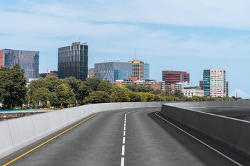 Empty urban asphalt road exterior with city buildings background. New modern highway concrete construction. Concept of way to success. Transportation logistic industry fast delivery. Boston. USA.
