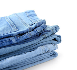 Stack of jeans on white background, closeup
