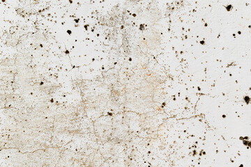 Dirty old cracked concrete wall with holes and stains. Grunge and rough wall texture background.