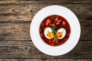 Red borsch - beetroots soup on wooden table