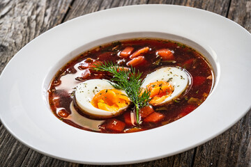 Red borsch - beetroots soup on wooden table