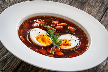 Red borsch - beetroots soup on wooden table