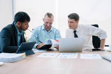 Group of diverse business people discussing a project in a meeting for analysis graph company financial.