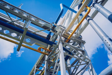 Modern steam pipeline for industrial on blue skies background.