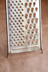 Vintage grater for cheese and vegetables. Macro view