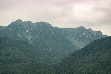 Naklejka premium mountain landscape with clouds