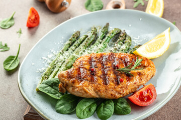 juicy chicken breast grilled with vegetables asparagus and parmesan, organic healthy products. Detox and clean diet concept. place for text, top view