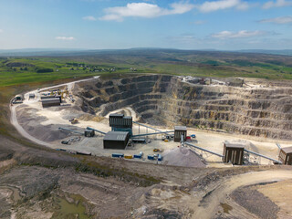 This aerial drone photo shows a large stone quarry in Yorkshire Dales National Park. This stone mine is named Coldstones Cut and is a famous landmark in this beautiful area in England. 