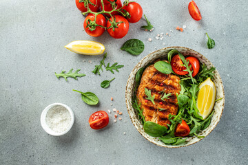 Roasted Chicken Fillet, green lettuce, arugula, tomatoes. Ketogenic diet. Low carb high fat breakfast. Healthy food concept. place for text, top view