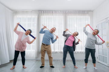 Obraz premium Senior lifestyle at home. Older adults exercise at their houses. Senior exercising at a convalescent facility.