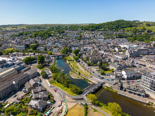 This aerial drone photo shows the large town of Kendal. The river Kent is going through the town center and makes it a really nice place. Kendal is located in the province of Cumbria in North England.