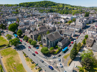 Fototapeta premium This aerial drone photo shows a beautiful old church in the town center of Kendal. Kendal is a large town in Cumbria, North-West England. 