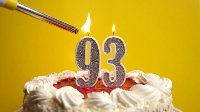 A candle in the form of the number 93, inserted into the holiday cake, is lit. Celebrating a birthday or a landmark event. The climax of the celebration.