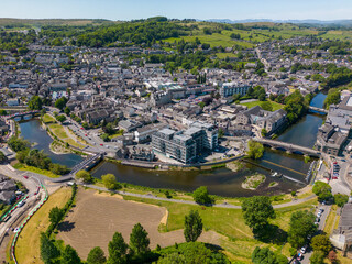 This aerial drone photo shows the large town of Kendal. The river Kent is going through the town...
