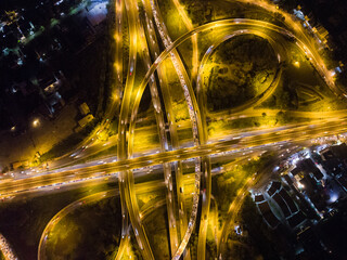 Aerial circular intersection transport city road at night with light
