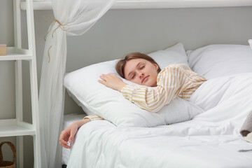 Morning of pretty young woman sleeping in soft bed