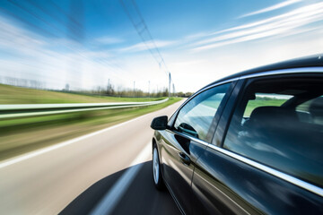 view from side of fast moving car motion blur
