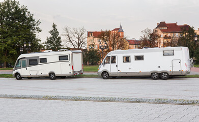 car campers traveling in city