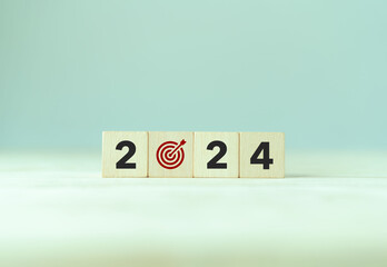 2024 goals of business or life. Wooden cubes with 2024 and goal icon on smart background. Starting to new year. Business common goals for planning new project, annual plan, business target achievement