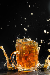 Beer with foam splash. Freeze motion splash drops of beer foam