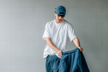 portrait of young urban male fighting with the jacket