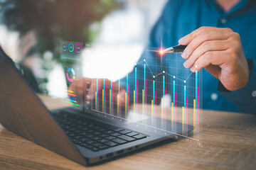 Smart digital marketing data management concept, Businessman use laptop to work on marketing analysis chart strategic planning sustainable development, and financial and business work growing target