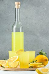 Italian lemon liqueur Limoncello shots. vertical image. top view. place for text