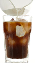 Pouring milk in coffee ice. Making  iced coffee with milk