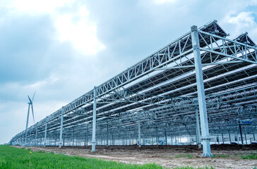 Fototapeta premium Large electrical power plant with many rows of solar photovoltaic panels