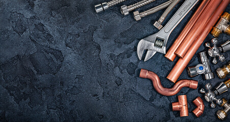 Free Space Plumbers Acessories On Stone Black Background.