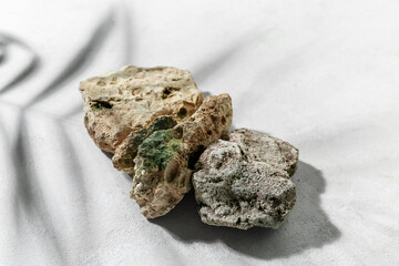 Decorative stone podiums on white table