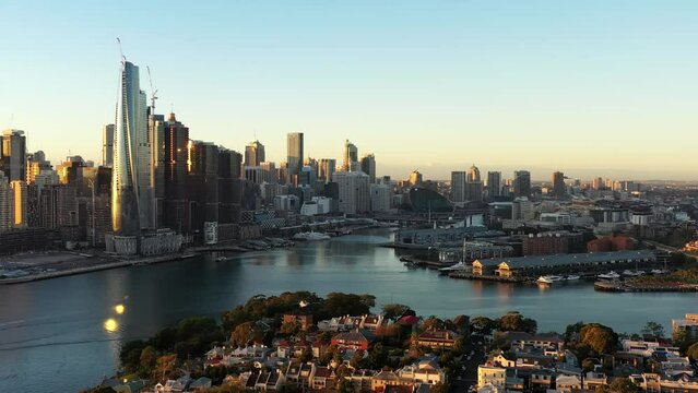 Aerial panorama of City of Sydney harbour waterfront landmarks sunrise 4k.
