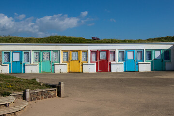 Colourful beach huts at crooklets beach in Bude, Cornwall