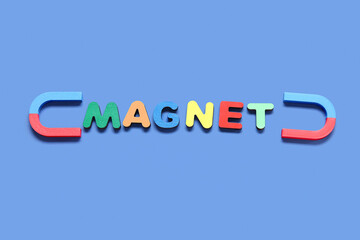 Horseshoe shaped magnets with word MAGNET on blue background