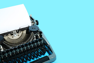 Vintage typewriter on blue background