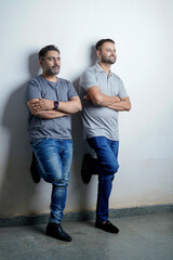 Two young indian man giving expression on white background.