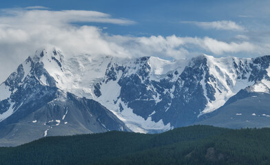 Obraz na płótnie Canvas Snow-capped mountain peaks, hiking in the mountains