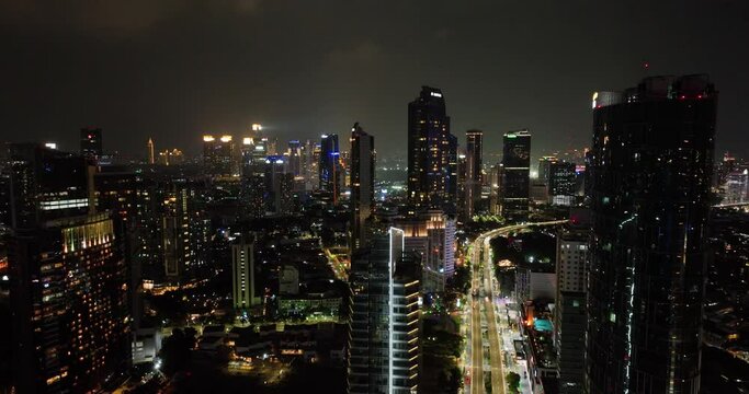 Top view of night panorama of Jakarta city with skyscrapers.