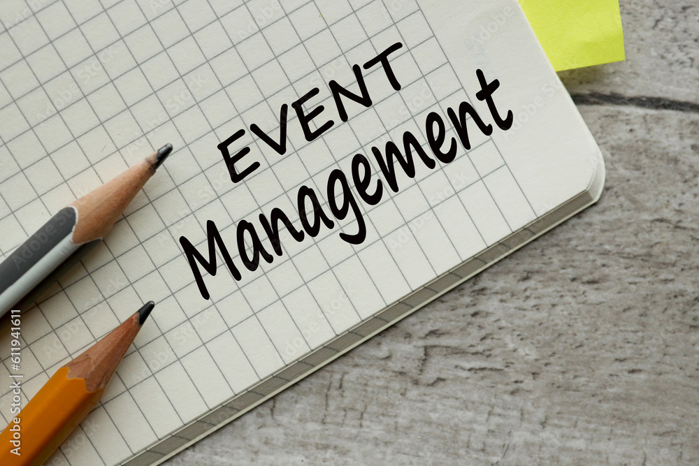 Aufkleber event management concept. notebook and pencils on the work table. word on page