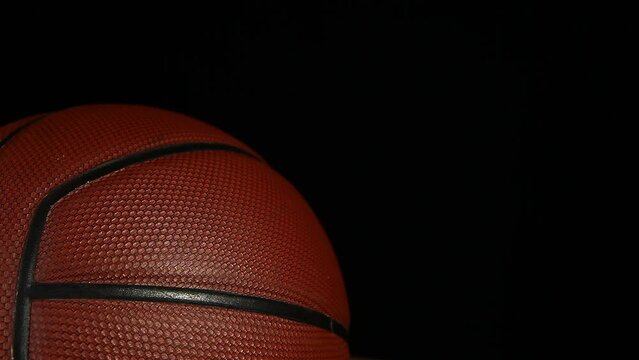 footage of rubber chicken basketball dark background