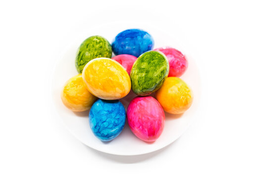 colorful easter eggs in white plate