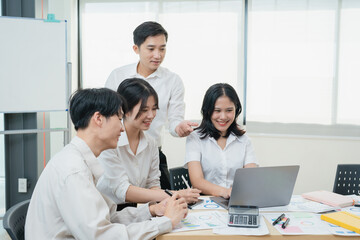 Fototapeta premium startup Asian business advisor meeting to analyze and discuss the situation on the financial report in the meeting room.Investment Consultant, Financial , teamwork ,brainstorming and accounting